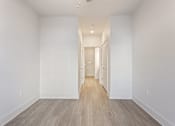 Thumbnail 9 of 37 - an empty room with white walls and wood floors