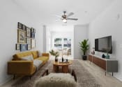 Thumbnail 1 of 57 - a living room with a yellow couch and a tv