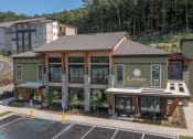 Thumbnail 1 of 43 - The Clubhouse Exterior at Canopy Park Apartments in Pelham, AL