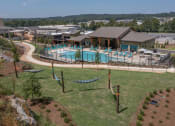 Thumbnail 13 of 43 - The hammock lounge and pool and sundeck at Canopy Park Apartments, Pelham, 35124