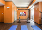 Thumbnail 32 of 42 - Cardio center with yoga mats and spin bikes  at LandonHouse in Lake Nona
