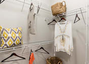 Thumbnail 21 of 30 - oversized closet with built in shelving and example storage