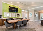 Thumbnail 6 of 30 - large community table and coffee station in clubhouse