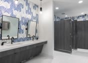 Thumbnail 9 of 48 - the clubhouse bathroom at Lake Nona Concorde with blue and white wall tiles