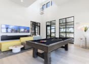 Thumbnail 5 of 48 - a pool table and sofa in Lake Nona Concorde clubhouse
