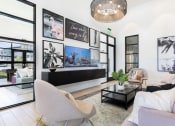 Thumbnail 4 of 48 - relaxing lounge with ample seating, a tv, and decor at Lake Nona Concorde