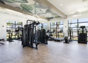 Thumbnail 23 of 48 - large fitness center with strength and cardio equipment at Lake Nona Concorde