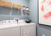 Thumbnail 44 of 48 - a large in-home laundry room with washer, dryer, and decor at Lake Nona Concorde