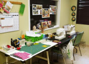 Thumbnail 11 of 18 - craft room with sewing machines and more at B'nai B'rith I, II, & III apartments in deerfield beach