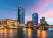 Thumbnail 8 of 8 - Grand Rapids, Michigan skyline with a river and a bridge at night