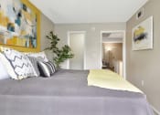 Thumbnail 24 of 32 - a bedroom with grey walls and yellow accents