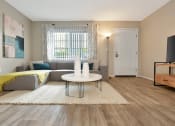 Thumbnail 14 of 32 - the model apartment living room with furnishings at The Oasis Daytona in Daytona Beach, FL
