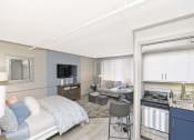 Thumbnail 2 of 24 - kitchen with stainless steel appliances, white and navy cabinets, and living space