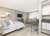 Thumbnail 4 of 24 - kitchen with stainless steel stove, and large living and bedroom area