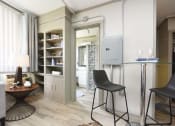 Thumbnail 9 of 24 - small dining area, built-in shelving, and bathroom entrance
