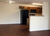 Thumbnail 7 of 18 - hardwood-inspired flooring in kitchen and living room