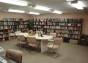 Thumbnail 10 of 18 - B'nai B'rith Deerfield Apartments in Deerfield Beach, FL well-stocked community library with seating