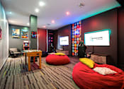 Thumbnail 10 of 40 - A room with a red bean bag chair and a sign that says "ArtSquare".