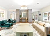 Thumbnail 1 of 57 - a living room with a couch and chairs