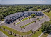 Thumbnail 51 of 57 - an aerial view of a large parking lot and a large building