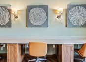 Thumbnail 12 of 57 - a conference room with chairs and paintings on the wall