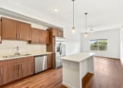 Thumbnail 15 of 57 - a kitchen with wooden cabinets and stainless steel appliances and a white counter top