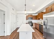 Thumbnail 18 of 57 - a kitchen with stainless steel appliances and a white counter top