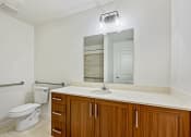 Thumbnail 25 of 57 - the preserve at ballantyne commons apartment bathroom with toilet sink and mirror