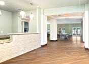Thumbnail 3 of 57 - a view of a lobby with a reception desk and a dining room