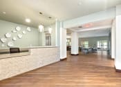 Thumbnail 4 of 57 - a lobby with a reception desk and a table with chairs