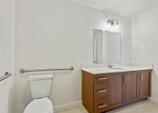 Thumbnail 49 of 57 - a bathroom with a toilet sink and mirror