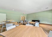 Thumbnail 53 of 57 - a dining room with tables and chairs and a fireplace