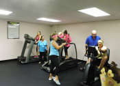 Thumbnail 16 of 18 - Residents enjoying the gym at B'nai B'rith I, II, III deerfield apartments in deerfield beach, FL
