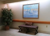 Thumbnail 13 of 18 - hallway seating at B'nai B'rith I, II, III deerfield apartments in deerfield beach, FL