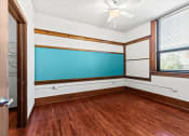 Thumbnail 2 of 12 - a large room with a wall chalkboard in an apartment at historic Horicon School