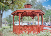 Thumbnail 18 of 18 - Orlando Cloisters gazebo under large tree and surrounded by lush grasses