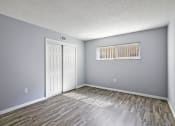 Thumbnail 24 of 37 - the living room of an empty house with wood flooring and a window