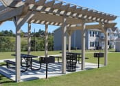 Thumbnail 11 of 18 - Pergola with picnic tables and grills