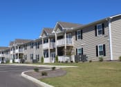 Thumbnail 15 of 18 - Ample parking in front of Southbrook Apartments on Cherry Avenue