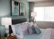 Thumbnail 20 of 30 - large window in bedroom with model furniture and decor  at Huntsville Landing Apartments, Alabama