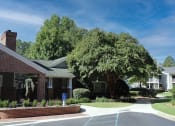 Thumbnail 8 of 18 - Lushly landscaped grounds near Stillwater at Grandview Cove's clubhouse