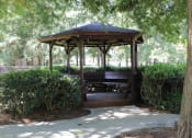 Thumbnail 14 of 18 - a gazebo with a bench at Stillwater at Grandview Cove in Simpsonville, SC