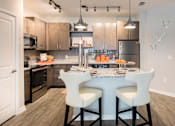 Thumbnail 14 of 30 - eat-in kitchen with pendant lighting over island
