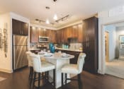 Thumbnail 12 of 42 - Kitchen with track and pendant lighting  at LandonHouse Apartments in Lake Nona, Orlando