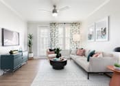 Thumbnail 19 of 40 - a living room with a couch and a tv
