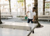 Thumbnail 7 of 42 - Man playing ping pong at LandonHouse Apartments