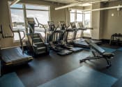 Thumbnail 42 of 42 - cardio equipment in front of windows in fitness center at Lake Nona Pixon, Florida, 32827