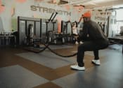 Thumbnail 41 of 42 - man working out with battle ropes in Pixon fitness center at Lake Nona Pixon, Orlando, FL, 32827