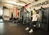 Thumbnail 40 of 42 - woman working out with resistance equipment at Pixon fitness center at Lake Nona Pixon, Florida, 32827