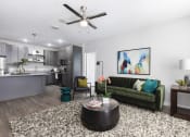 Thumbnail 24 of 44 - Open concept apartment  living room and kitchen at Residences at The Green in Lakewood Ranch, FL